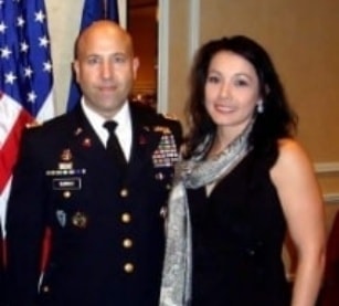 Andrea Murray with a U.S. Army officer at a formal military event