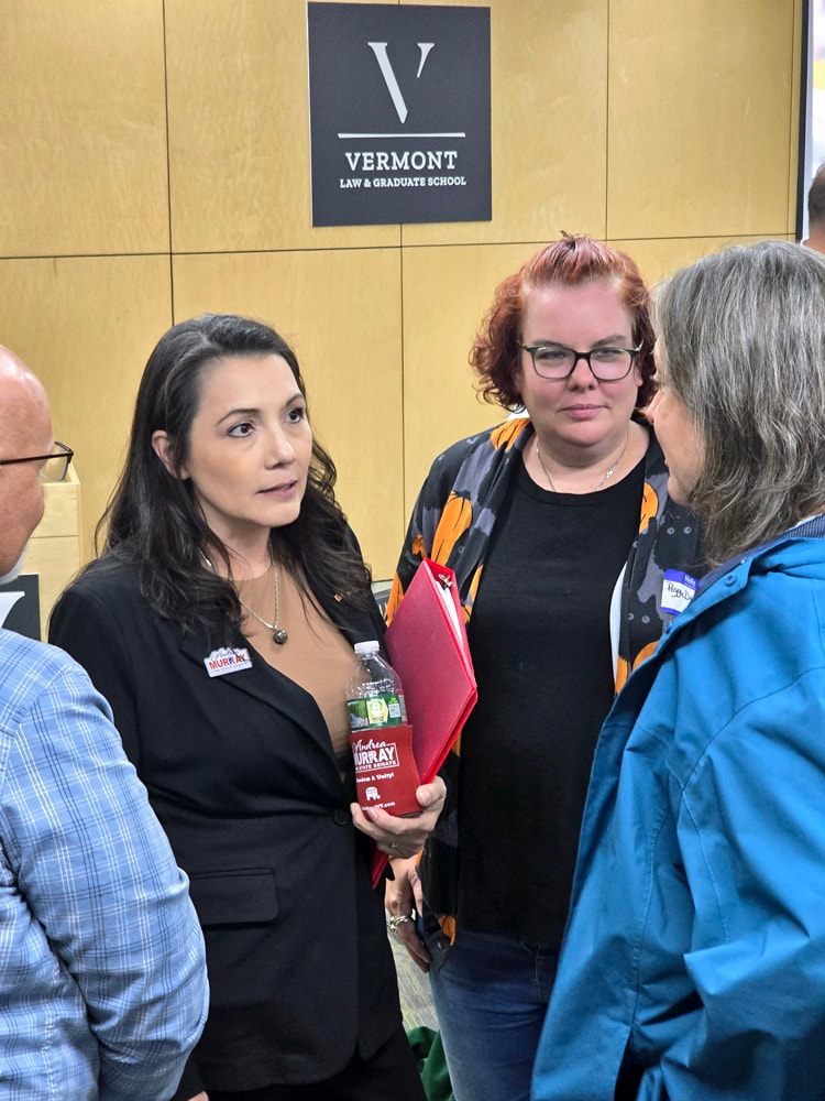 Andrea Murray greeting community members at a local event