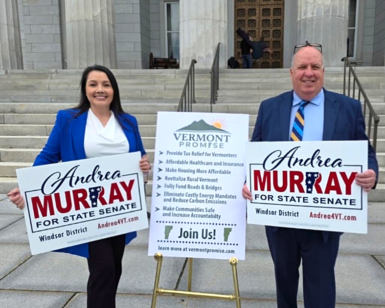 Andrea Murray and supporter holding Vermont Promise and campaign signs at the statehouse